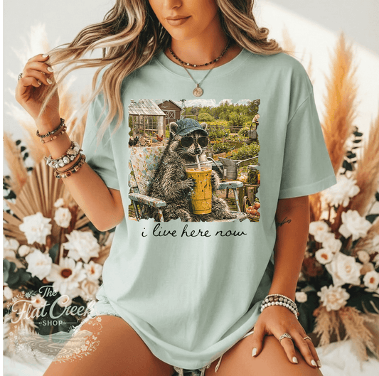 Garden Raccoon Shirt – "I Live Here Now" Homestead Tee | Cottagecore Garden & Farm Life ShirtSThe Flat Creek Shop LLC