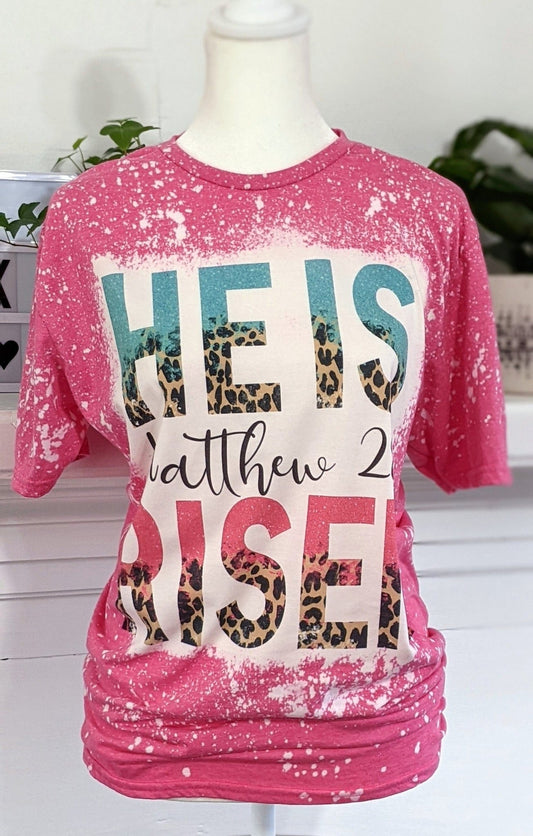 He Is Risen Easter T-Shirt | Bleached Pink Leopard Print Christian TeeSThe Flat Creek Shop LLC